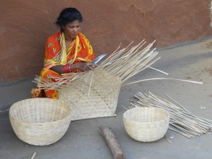 Weaving together strands of bamboo